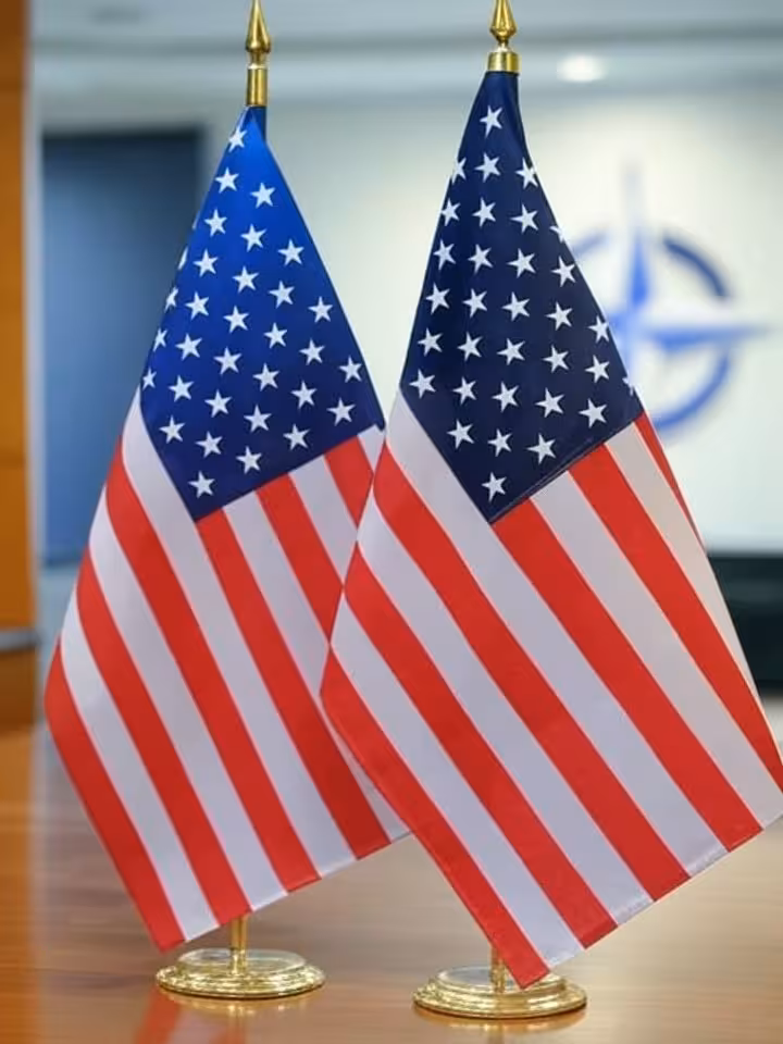 European and American flags side by side, transatlantic alliance symbolism, NATO era imagery, profes